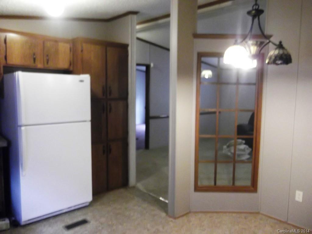 5664 Bill Sain Road Vale, NC 28168 - Photo 9 of 24 a refrigerator freezer sitting in a kitchen