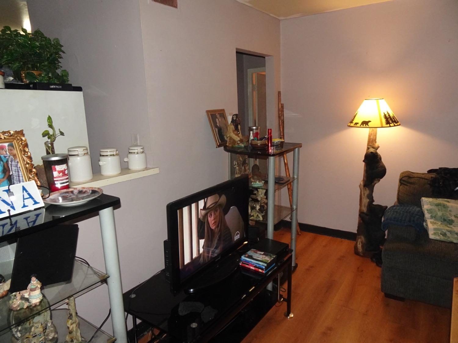 313 North Clark Street Knox, IN 46534 - Photo 2 of 13 a living room with furniture and a fireplace
