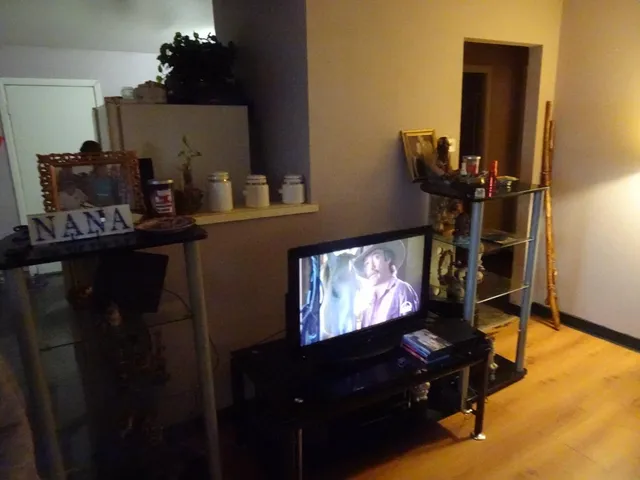 a room with furniture and flat screen tv