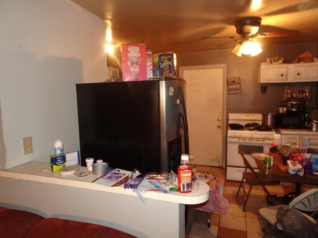a dining room with furniture and a flat screen tv