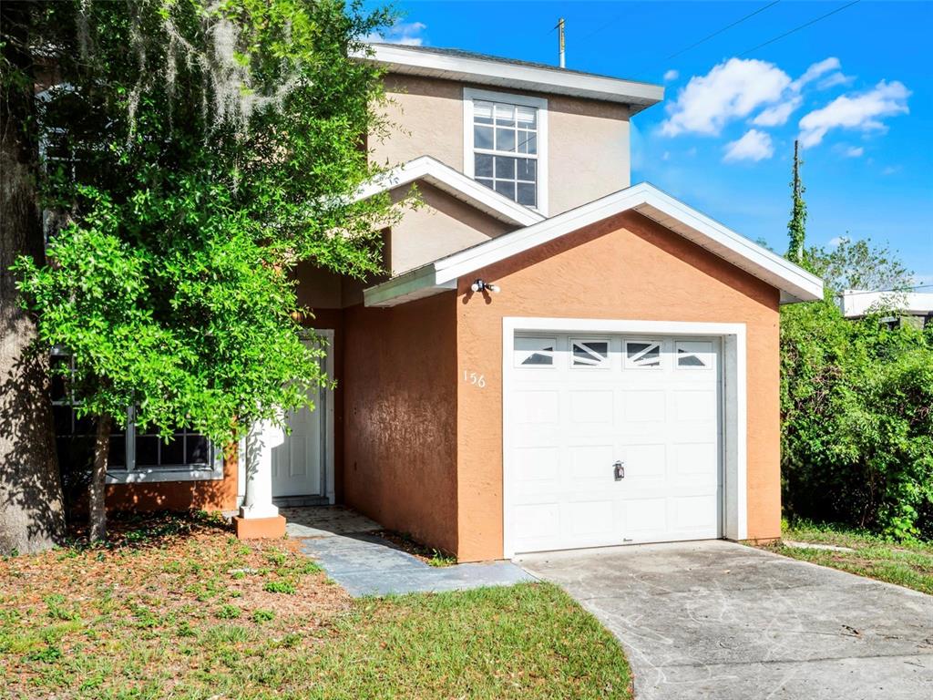 156 Oak Grove Road Winter Park, FL 32789 - Photo 1 of 1 a backyard of a house with yard and outdoor seating