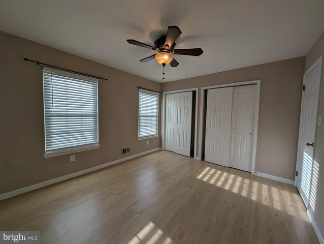a view of livingroom with window ceiling fan and hardwood floor