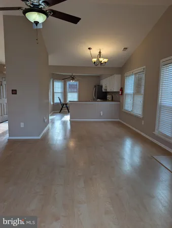 a view of a livingroom with a kitchen