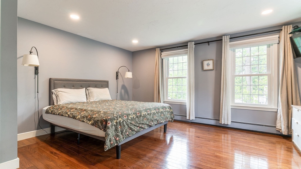 142 Baker Street Walpole, MA 02081 - Photo 28 of 42 a bedroom with a bed and window