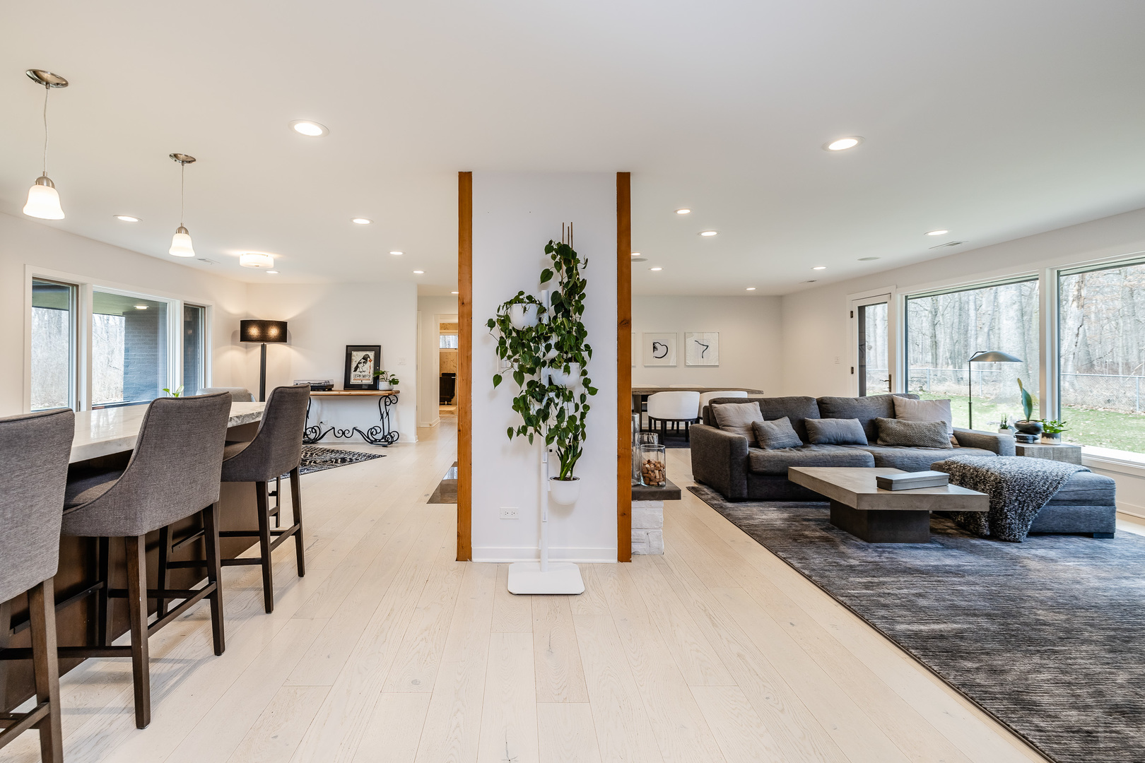 3060 Orange Brace Road Riverwoods, IL 60015 - Photo 11 of 36 a living room with furniture kitchen view and a large window