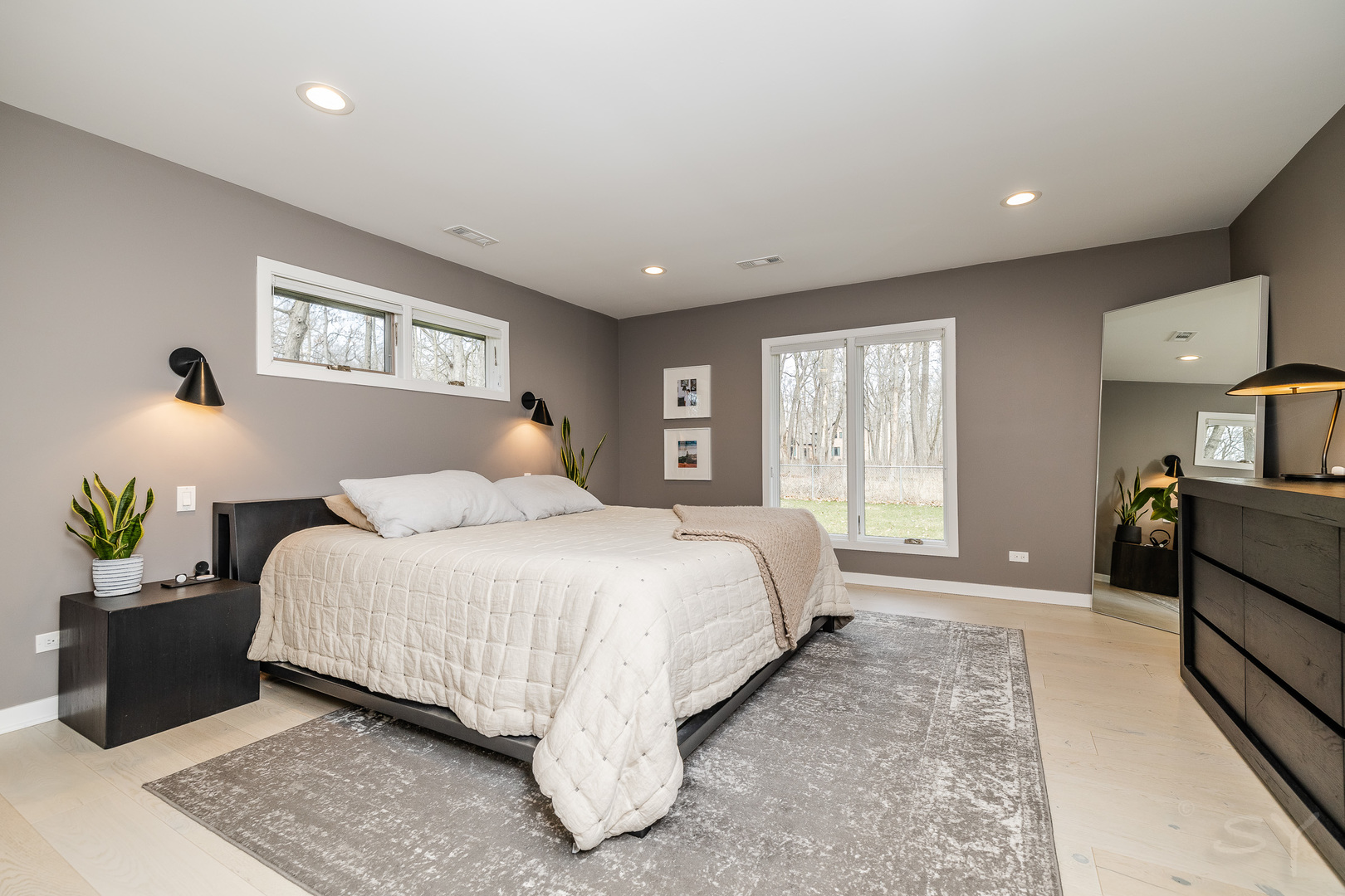 3060 Orange Brace Road Riverwoods, IL 60015 - Photo 19 of 36 a spacious bedroom with a bed and a couch