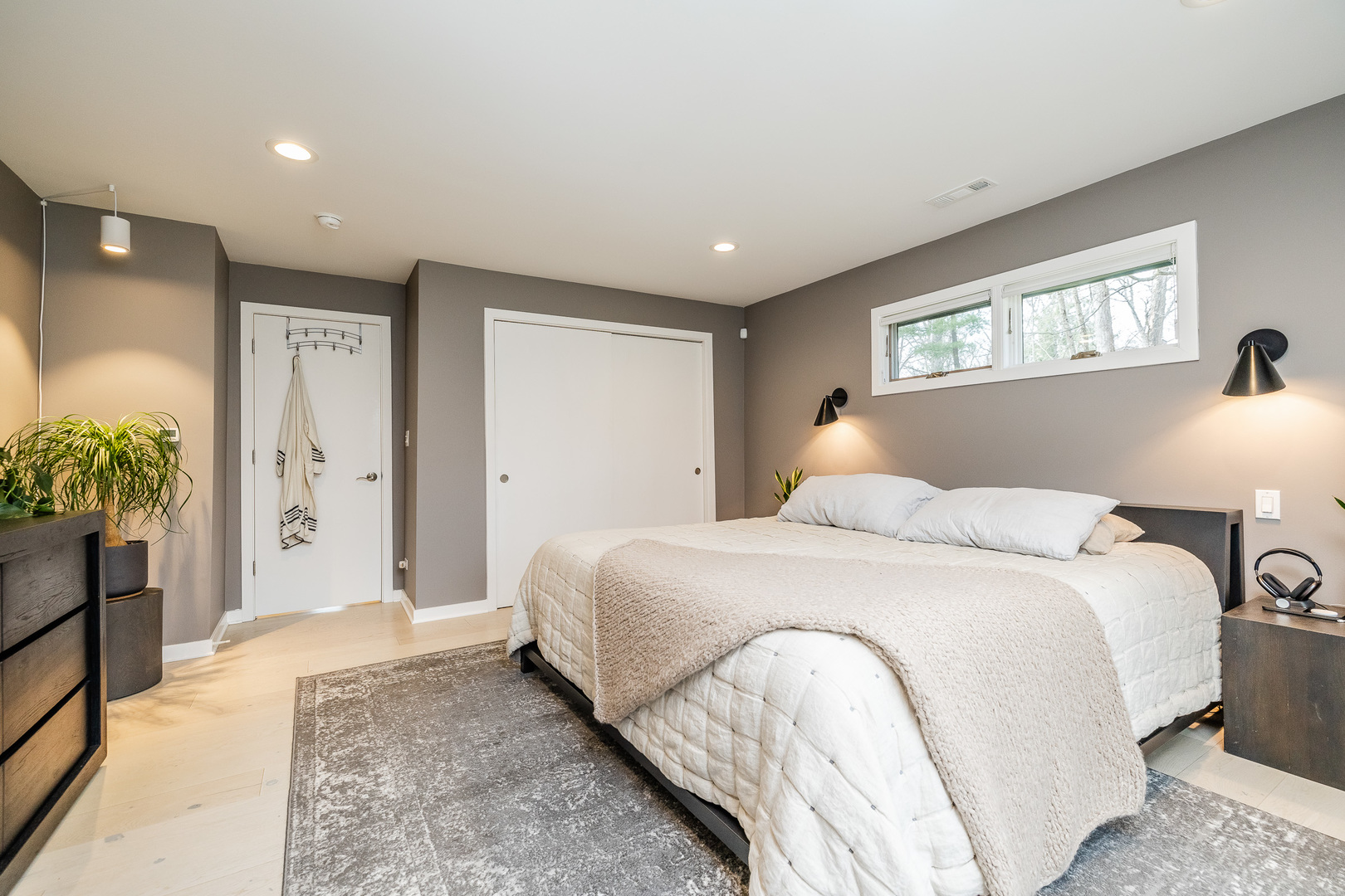 3060 Orange Brace Road Riverwoods, IL 60015 - Photo 20 of 36 a bedroom with a large bed and a chandelier