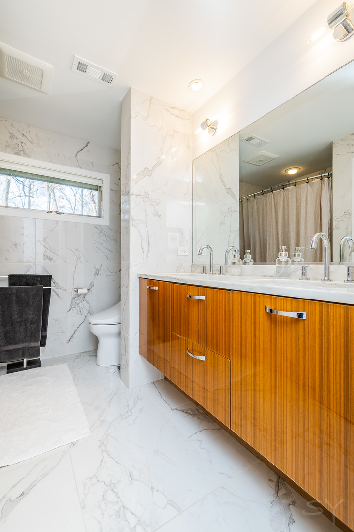 3060 Orange Brace Road Riverwoods, IL 60015 - Photo 23 of 36 a bathroom with a granite countertop sink mirror vanity and toilet