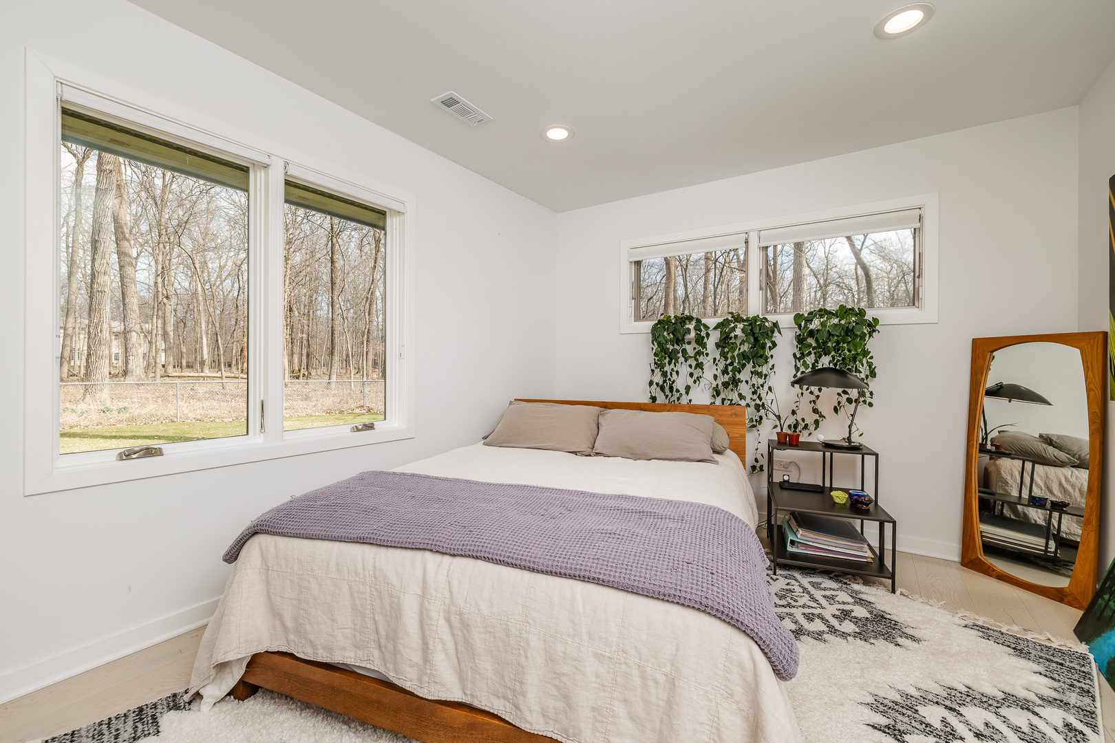 3060 Orange Brace Road Riverwoods, IL 60015 - Photo 28 of 36 a bedroom with a bed a table and a large window