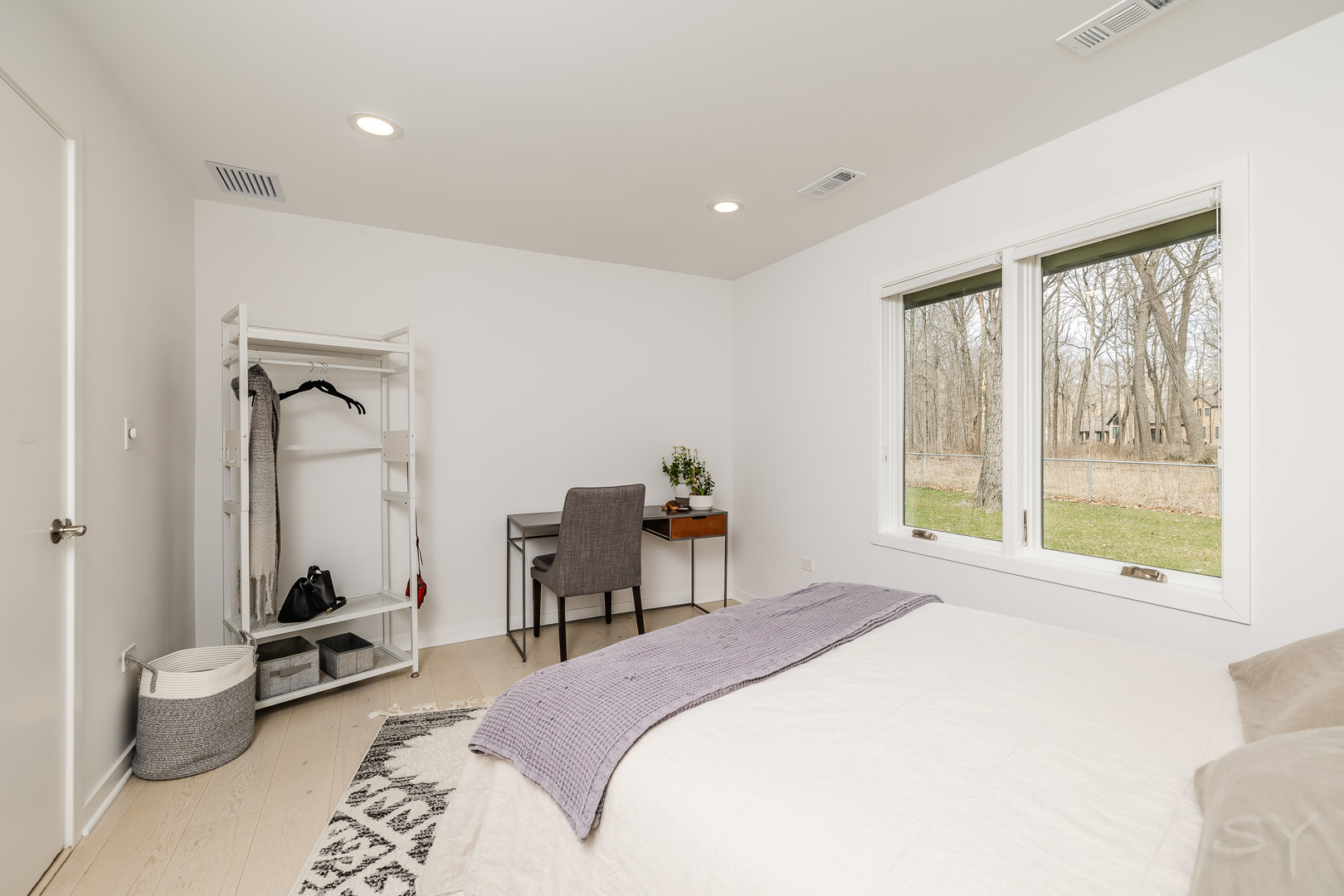3060 Orange Brace Road Riverwoods, IL 60015 - Photo 29 of 36 a bedroom with a bed and a wooden floor