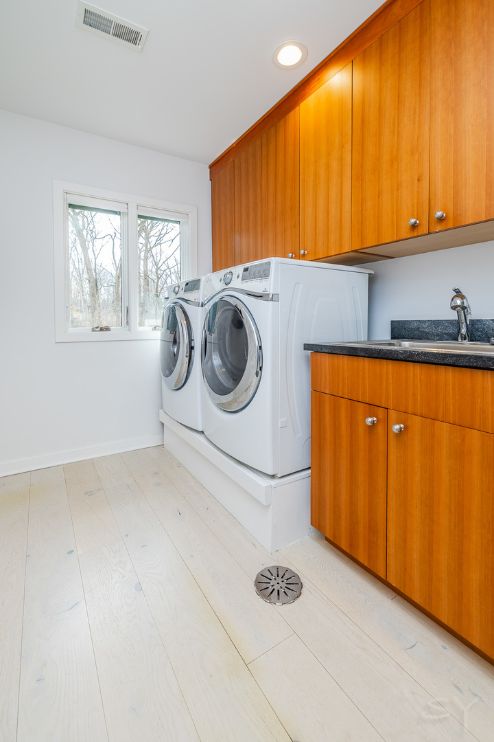 3060 Orange Brace Road Riverwoods, IL 60015 - Photo 31 of 36 a utility room with dryer and washer