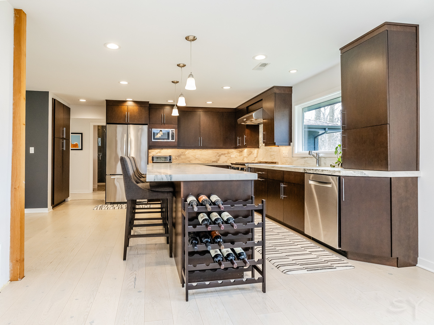 3060 Orange Brace Road Riverwoods, IL 60015 - Photo 7 of 36 a kitchen with stainless steel appliances kitchen island granite countertop a sink and cabinets
