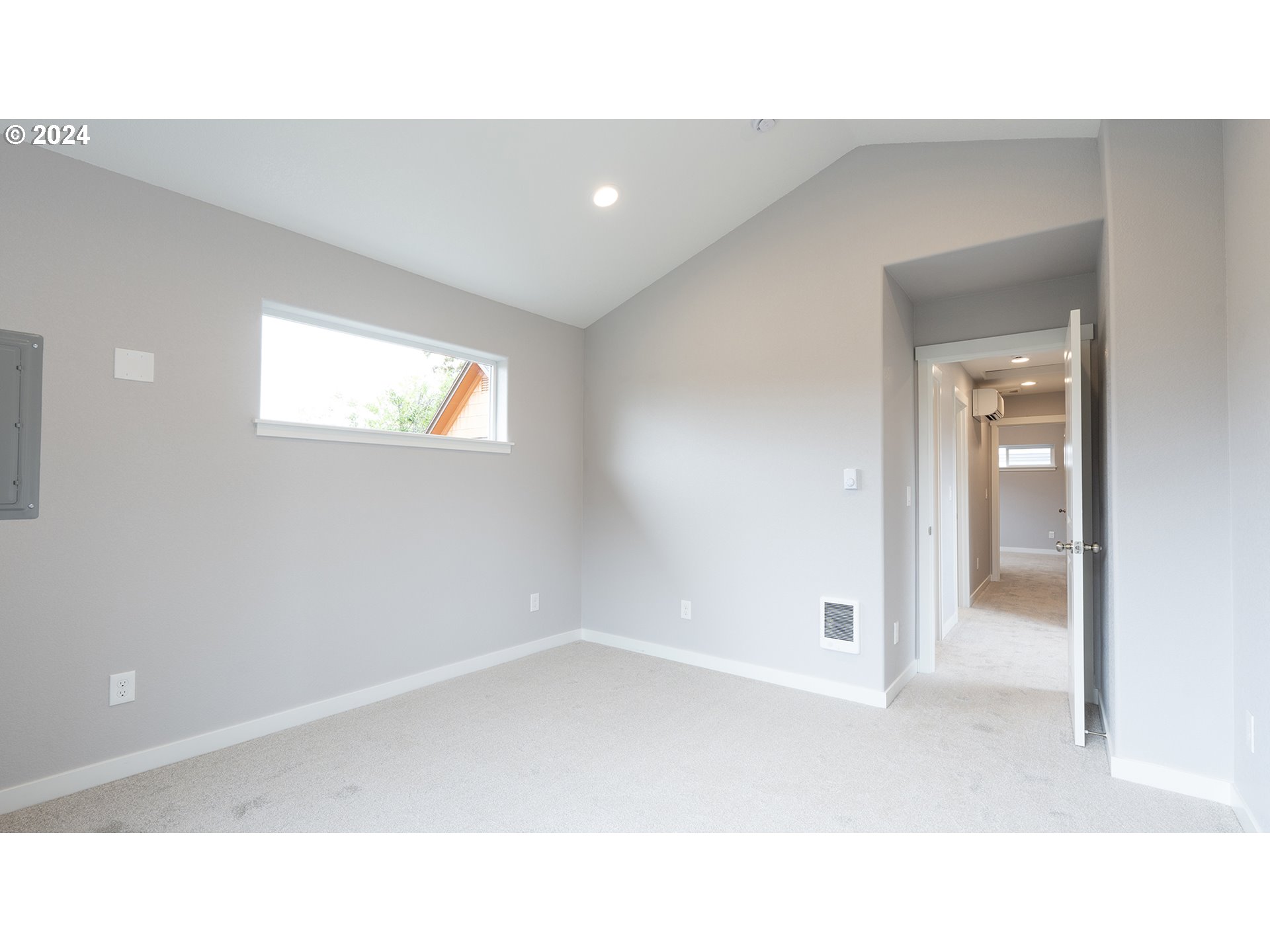 6921 Southeast Pardee Street, Unit A Portland, OR 97206 - Photo 12 of 16 a open hall with a floor to ceiling window