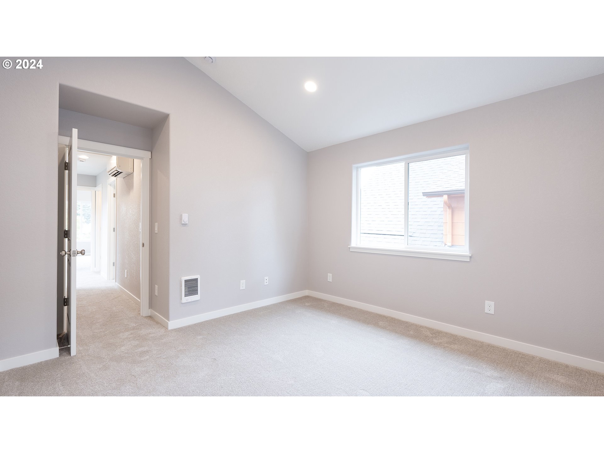 6921 Southeast Pardee Street, Unit A Portland, OR 97206 - Photo 15 of 16 a open hall with a hardwood floor