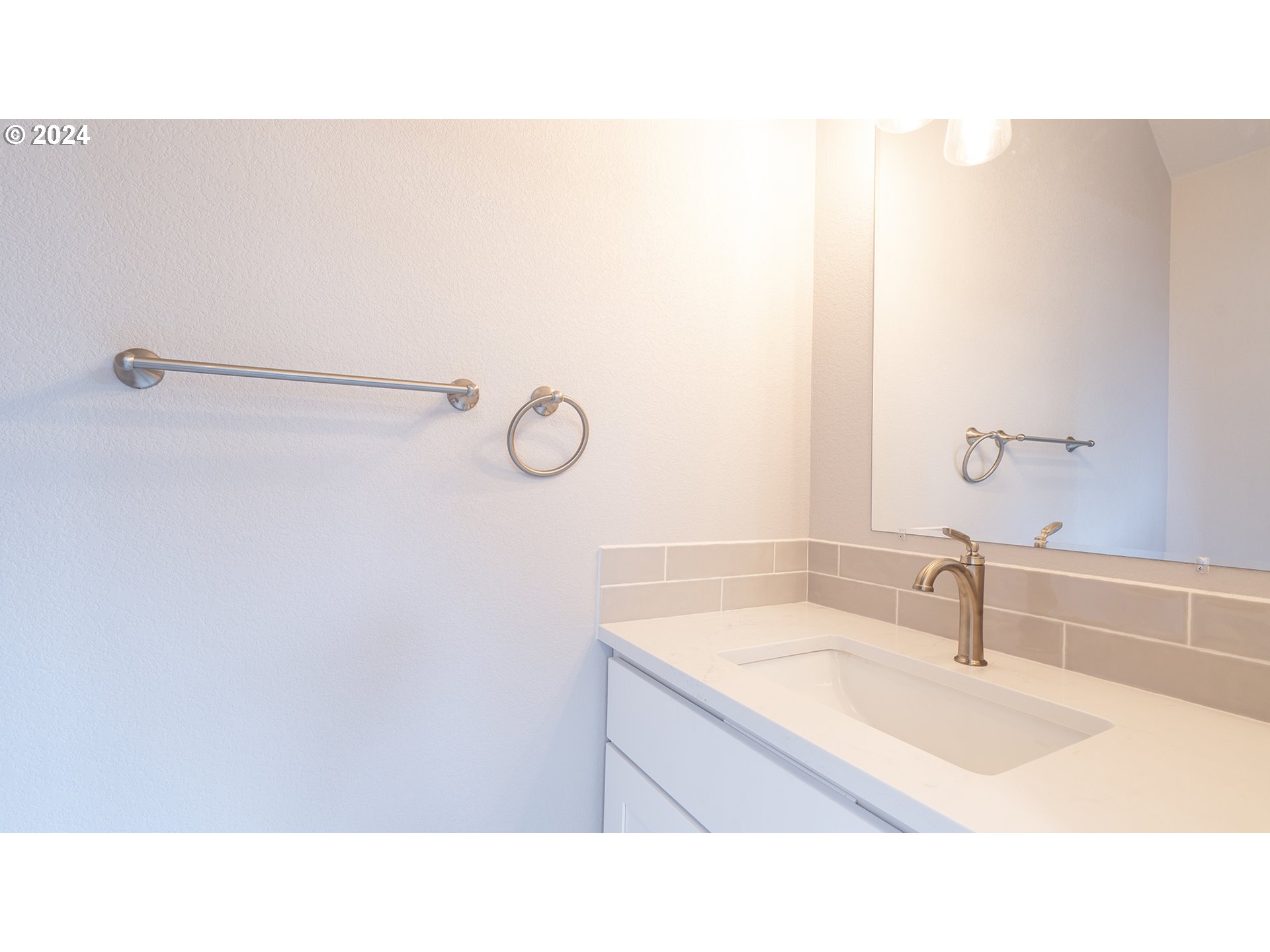 6921 Southeast Pardee Street, Unit A Portland, OR 97206 - Photo 8 of 16 a bathroom with a sink and a mirror