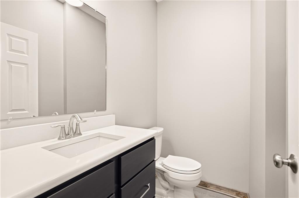 1311 Main Street Berlin, PA 15530 - Photo 11 of 36 a bathroom with a sink toilet and a mirror