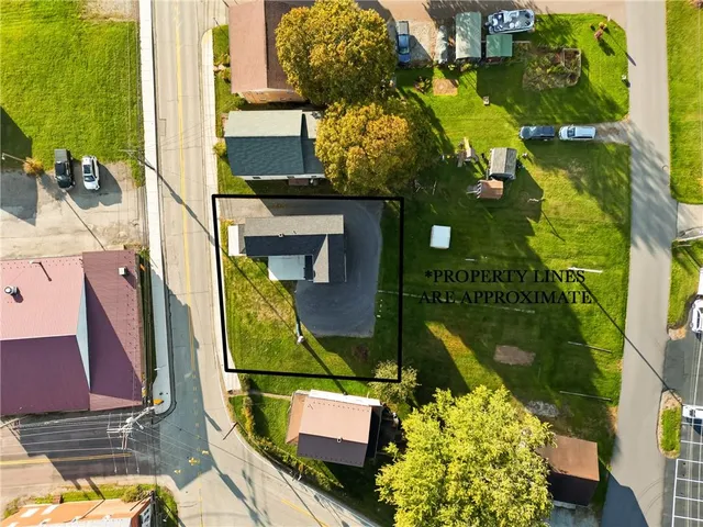 an aerial view of a house with a garden