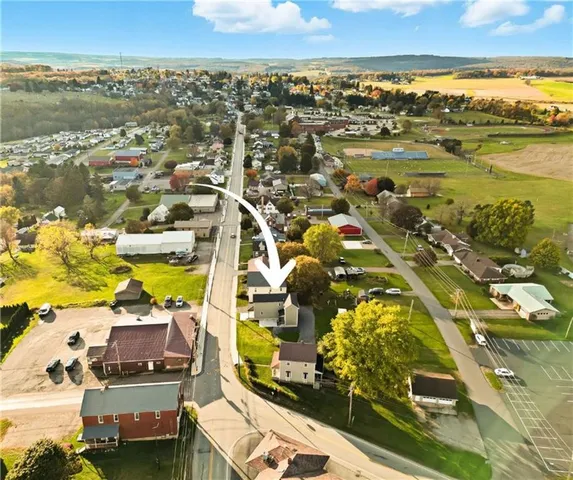 an aerial view of residential building and lake