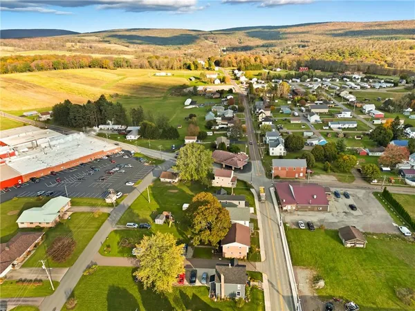 an aerial view of residential houses with outdoor space