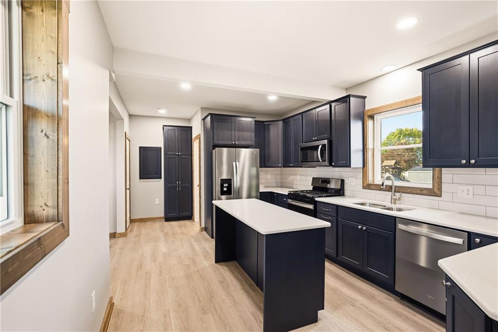 1311 Main Street Berlin, PA 15530 - Photo 5 of 36 a kitchen with stainless steel appliances granite countertop a sink stove and refrigerator