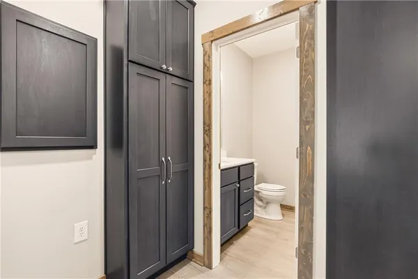 a bathroom with a toilet and a shower