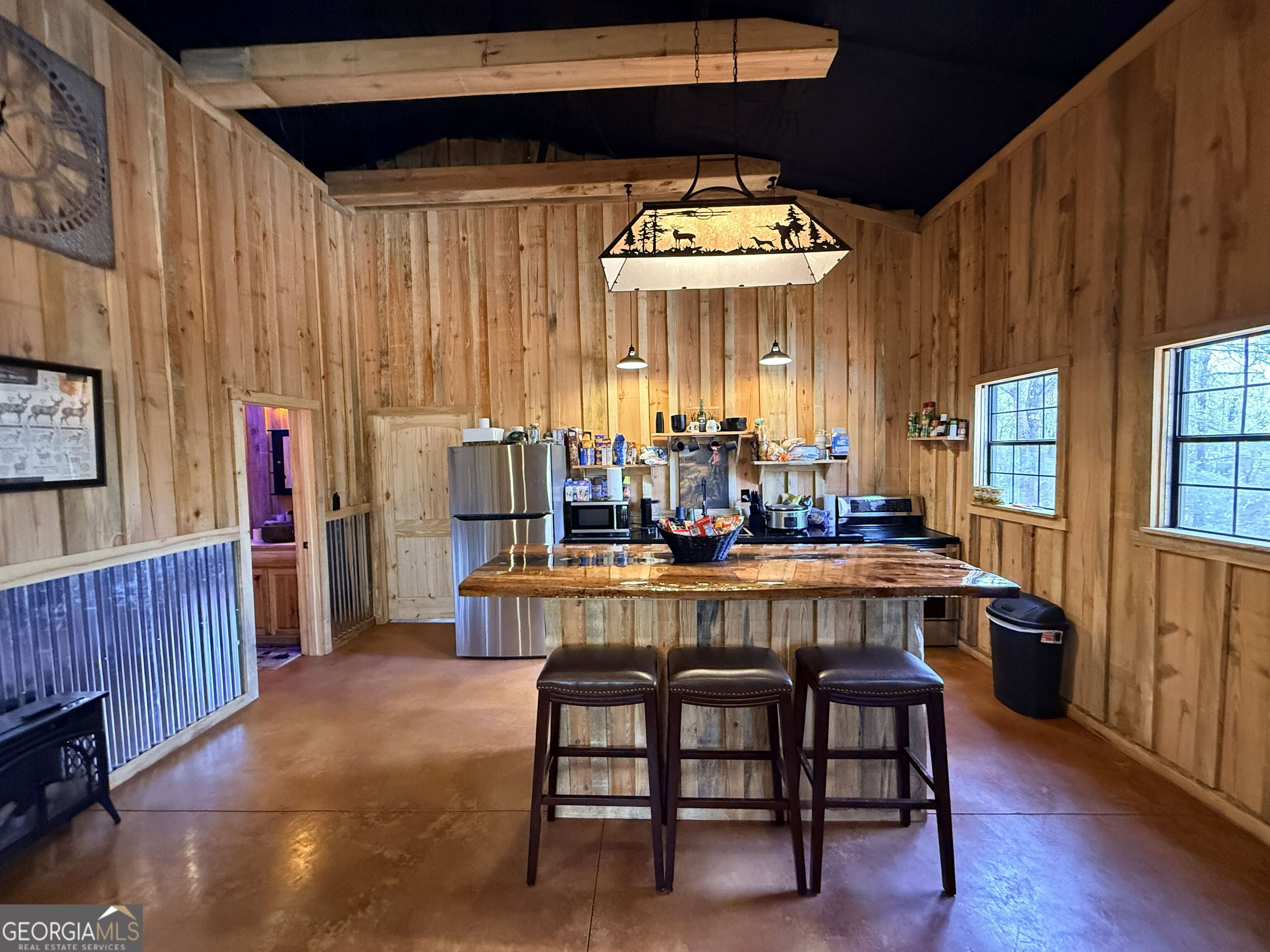 301 Beaver Dam Road Toomsboro, GA 31090 - Photo 16 of 99 a large kitchen with a table and chairs