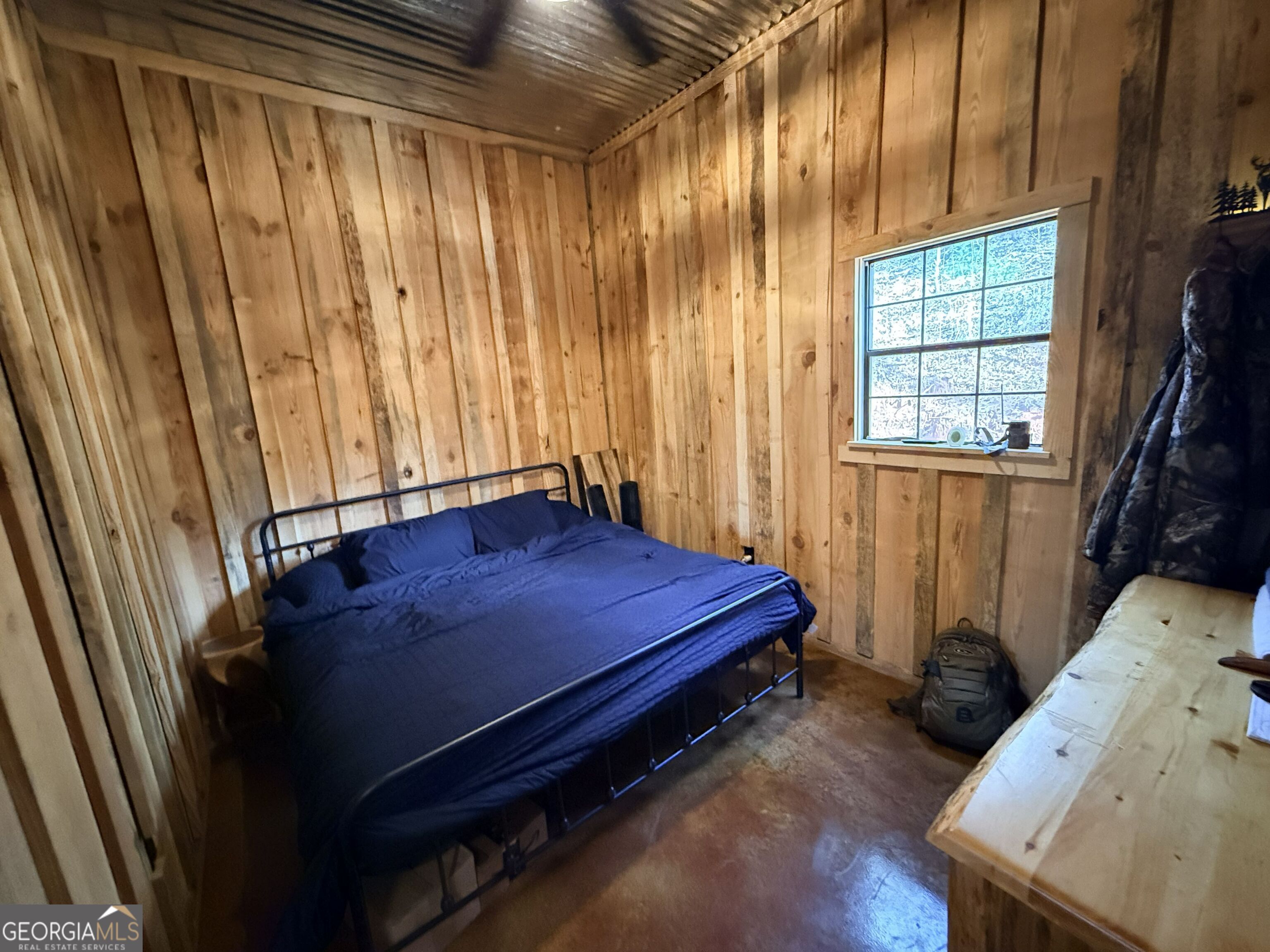301 Beaver Dam Road Toomsboro, GA 31090 - Photo 21 of 99 a bed sitting in a room next to a window