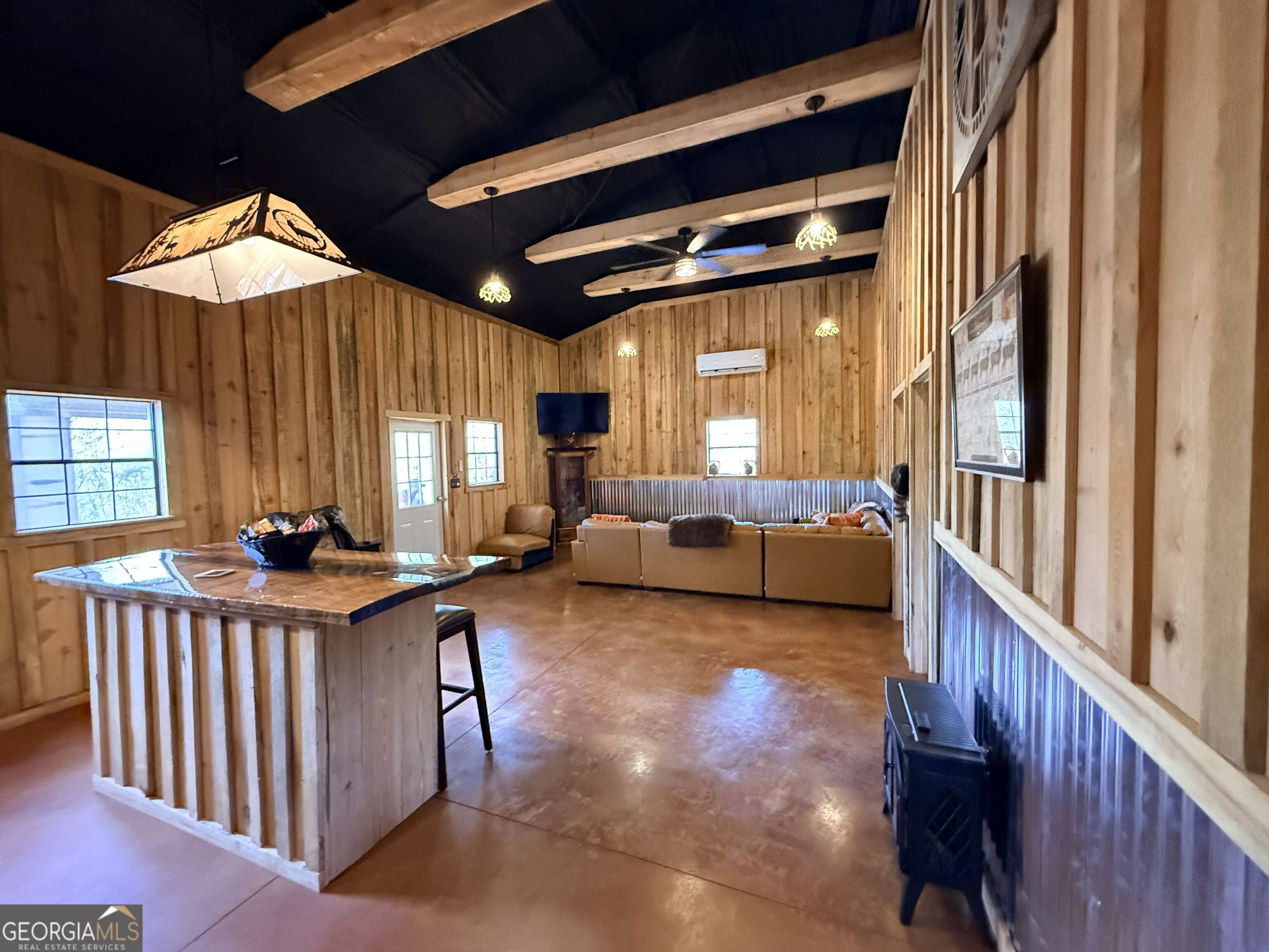 301 Beaver Dam Road Toomsboro, GA 31090 - Photo 37 of 99 a bedroom with furniture and a large window
