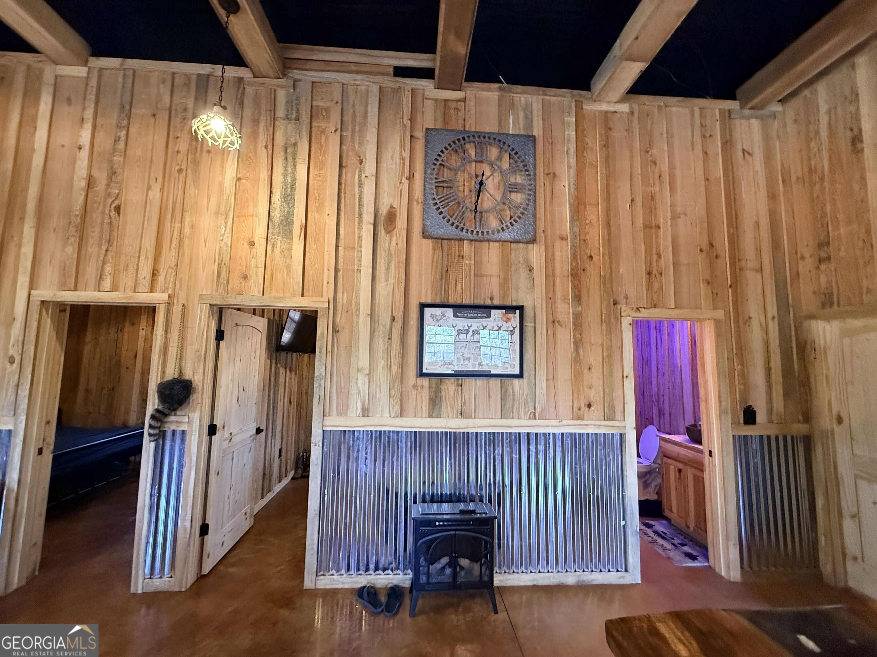 301 Beaver Dam Road Toomsboro, GA 31090 - Photo 38 of 99 a view of a hallway with wooden floor and windows