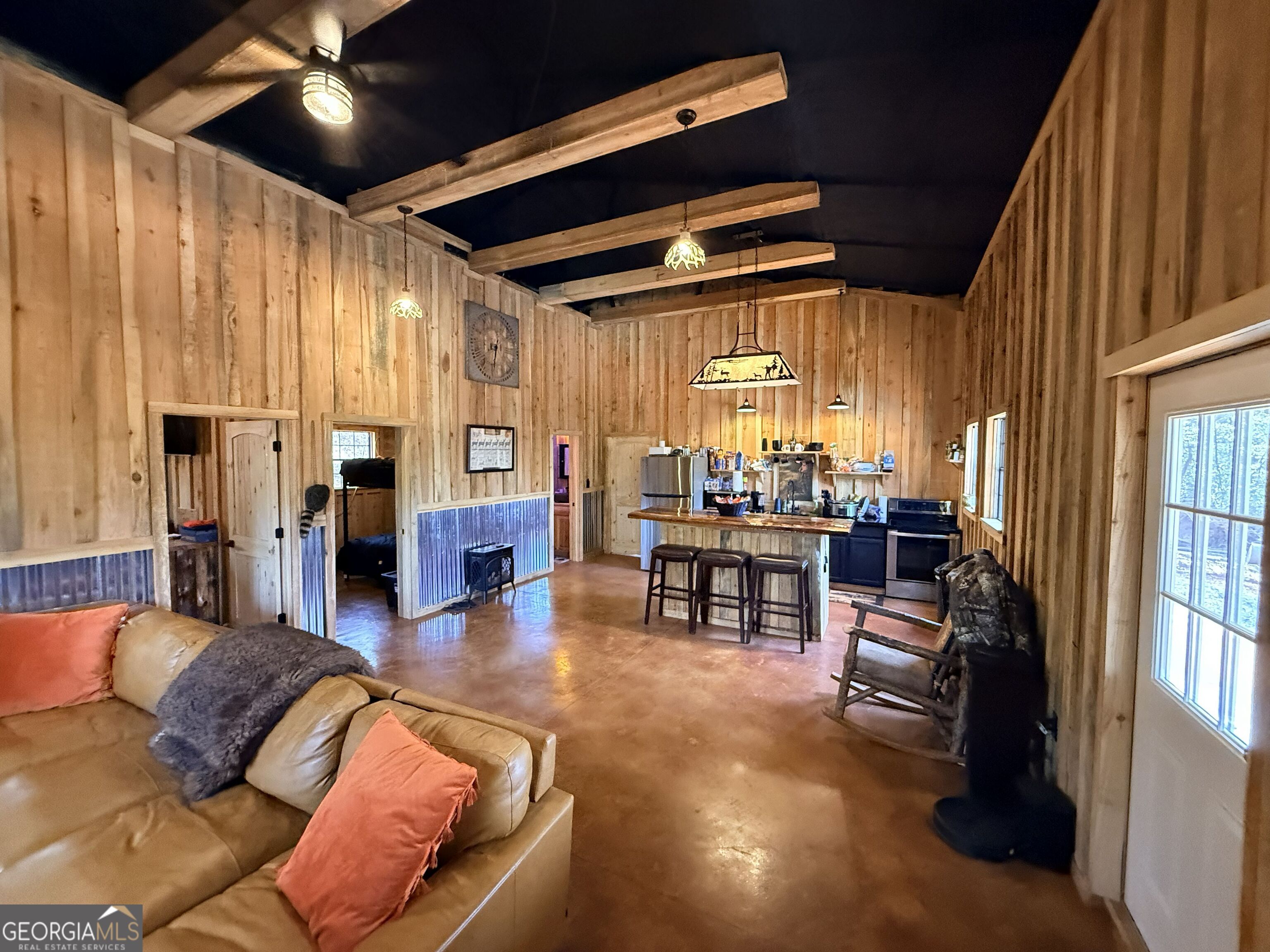 301 Beaver Dam Road Toomsboro, GA 31090 - Photo 48 of 99 a living room with lots of furniture and a large window