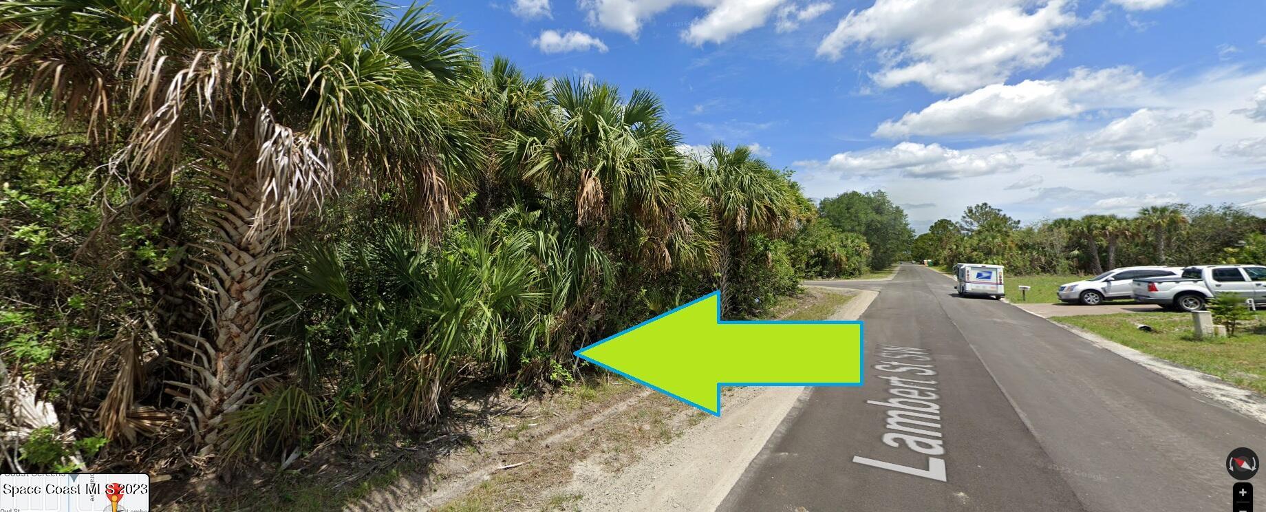 541 Lambert Street Southwest Palm Bay, FL 32908 - Photo 1 of 5 a view of a street with a car park side of the road