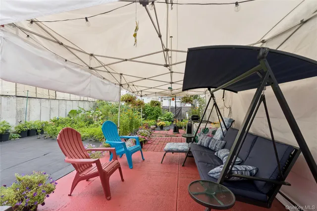 a view of backyard with seating space and furniture