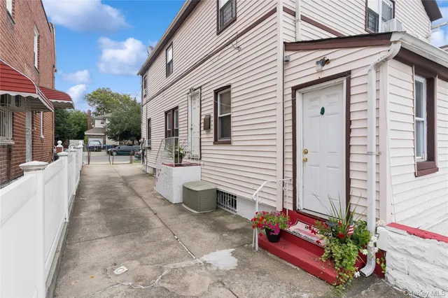 a view of a patio with table and chairs potted plants
