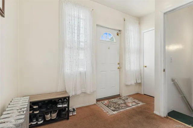 a view of bedroom with a bed and a dresser