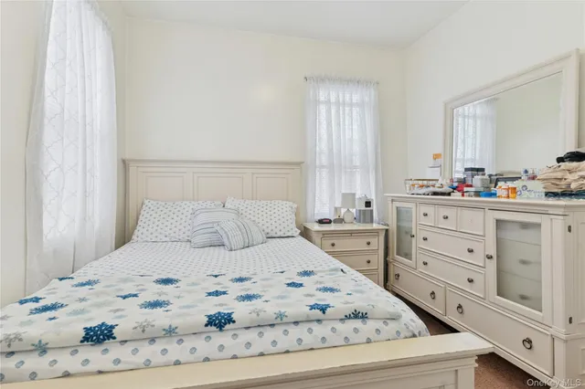 a large white bed in a white room