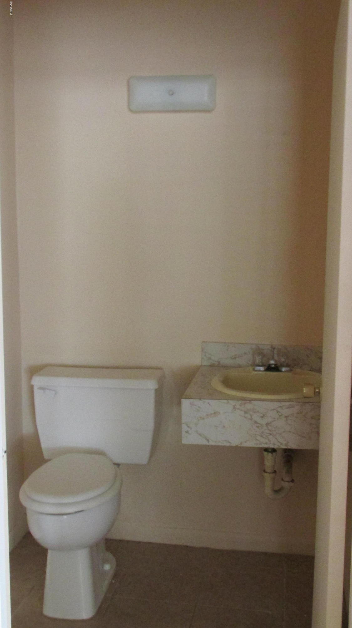 1801 North Wickham Road, Unit 7 Melbourne, FL 32935 - Photo 6 of 6 a bathroom with a toilet and a sink