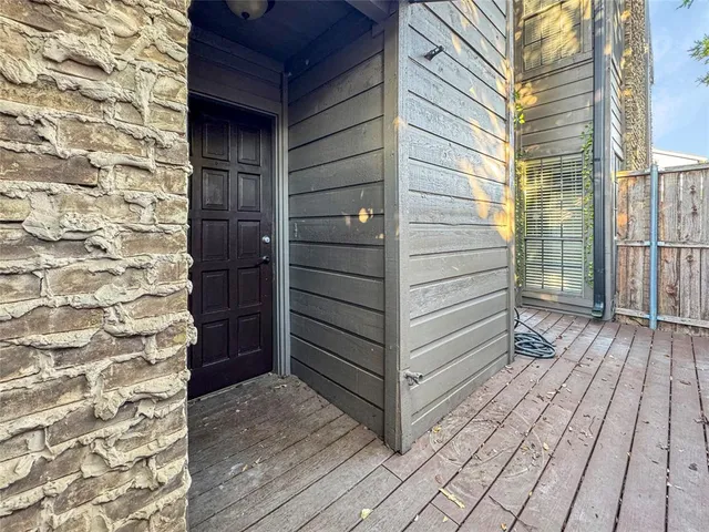 a view of outdoor space and wooden deck