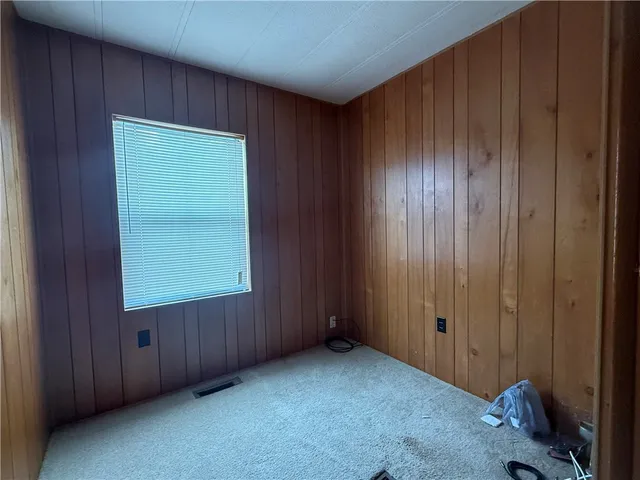 a bathroom with a toilet a sink and a mirror