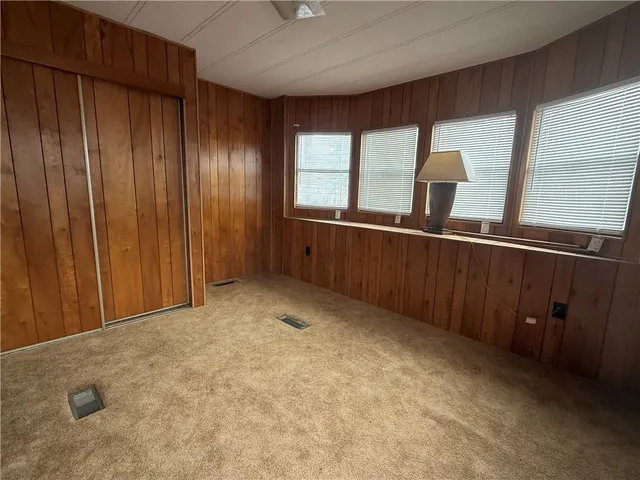 a bathroom with a sink a toilet a mirror and shower curtain