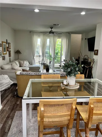 a view of kitchen with kitchen island dining table and chairs