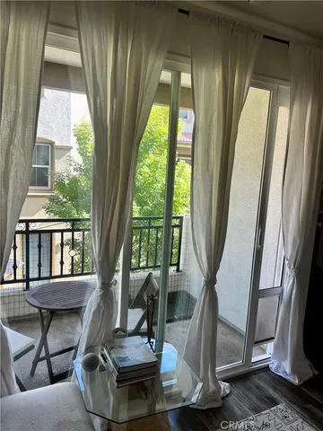 a view of a living room with a floor to ceiling window