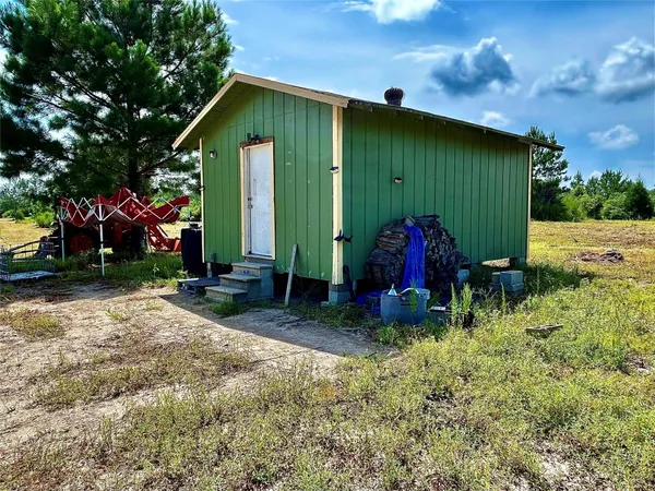 a room with wooden floor and a window