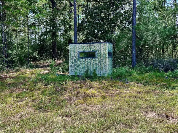 a view of a yard with an outdoor space and trampoline