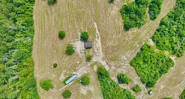 a view of a lake with a yard