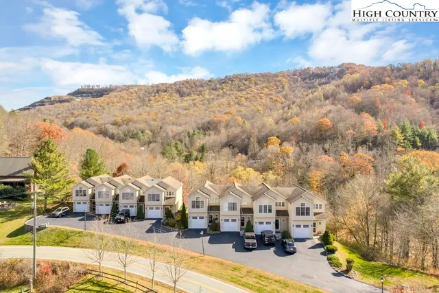 a view of residential houses with outdoor space