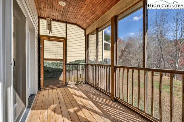 a view of a balcony with wooden floor