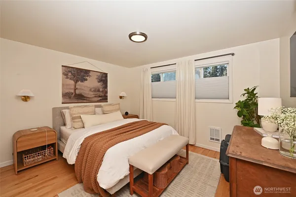 a bedroom with a bed and a table