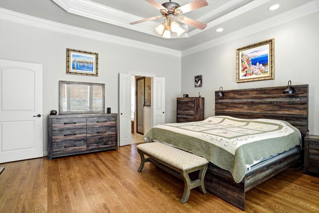 620 Highview Lane Hurst, TX 76054 - Photo 26 of 40 a bedroom with a bed and a dresser