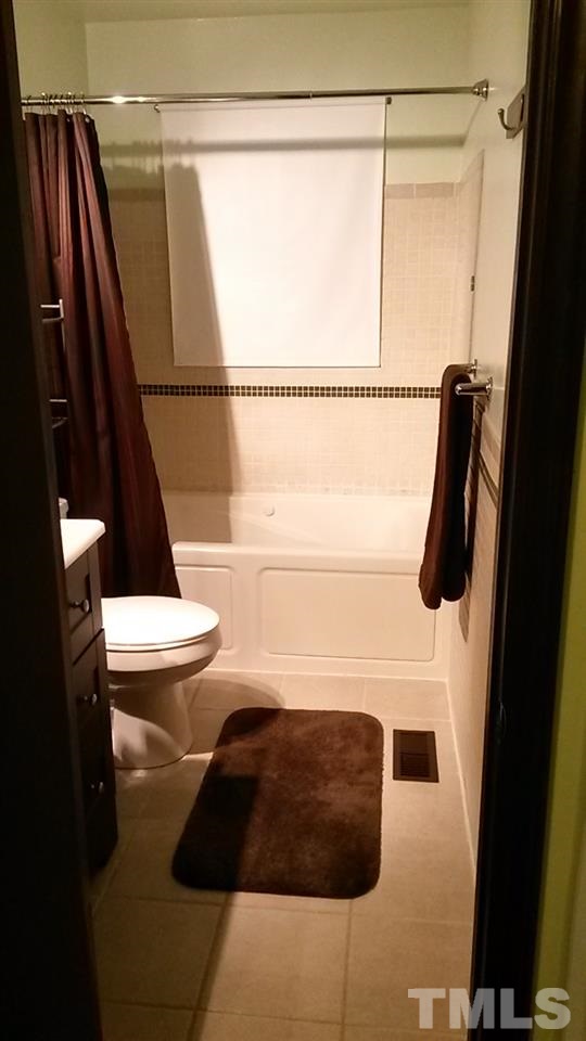 1144 Brighton Road Raleigh, NC 27610 - Photo 11 of 24 a bathroom with a sink and a shower
