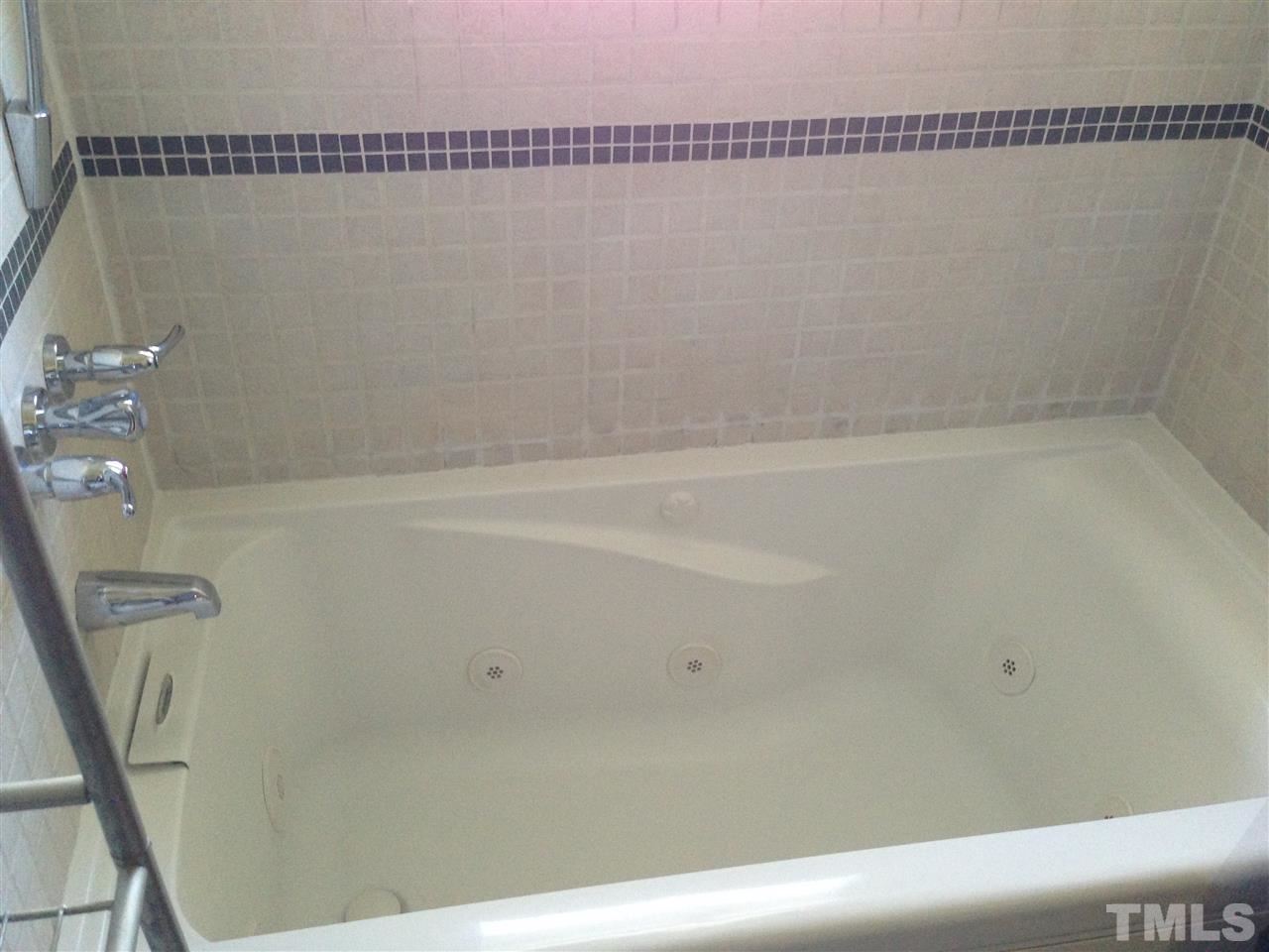 1144 Brighton Road Raleigh, NC 27610 - Photo 12 of 24 a bathroom with a bathtub